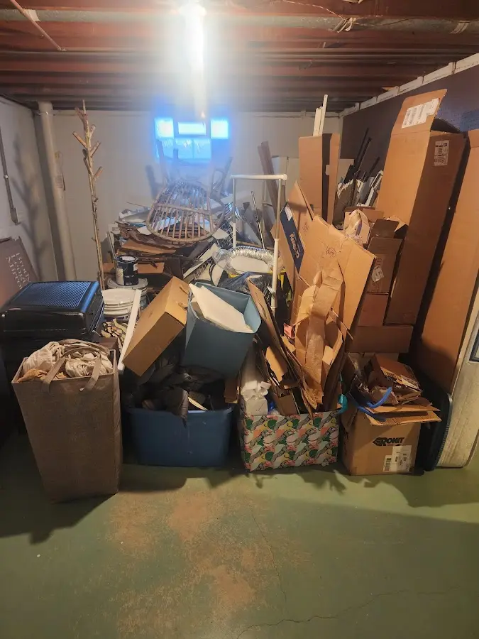 Roll-off dumpster container at job site for 2 Yard Dumpster Rental in Rose Hill