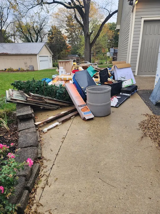 Dumpster being loaded with debris for 30 Yard Dumpster Rental in Rose Hill